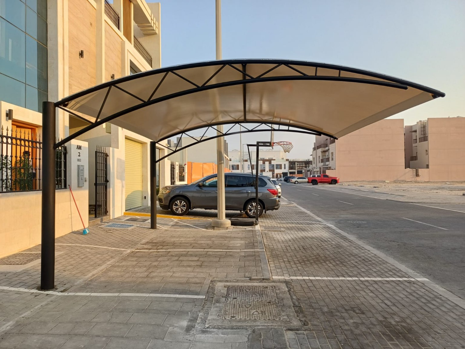 Bow-Truss Roadside Parking Shade installed in the UAE