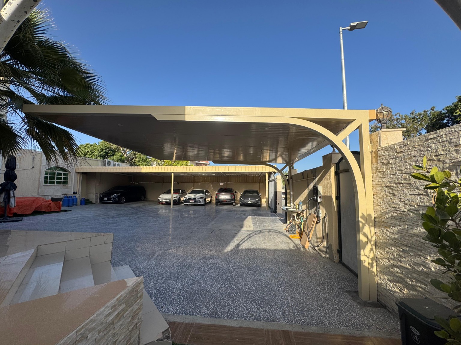 Curved-Bracket Flat Panel Carport installed in the UAE