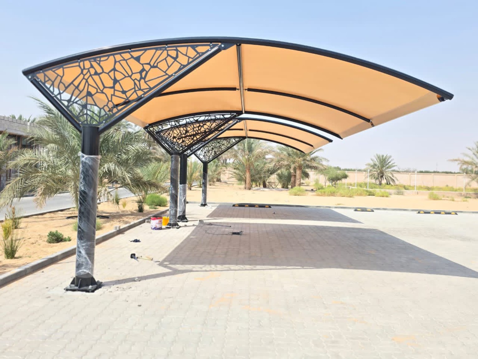 Decorative Curved Cantilever Parking Shade installed in the UAE